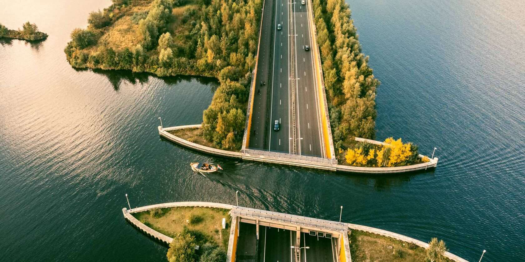 A road divided by a lake.