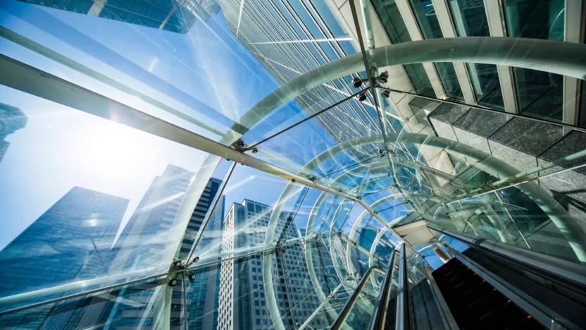 glass covered escalator ascending up