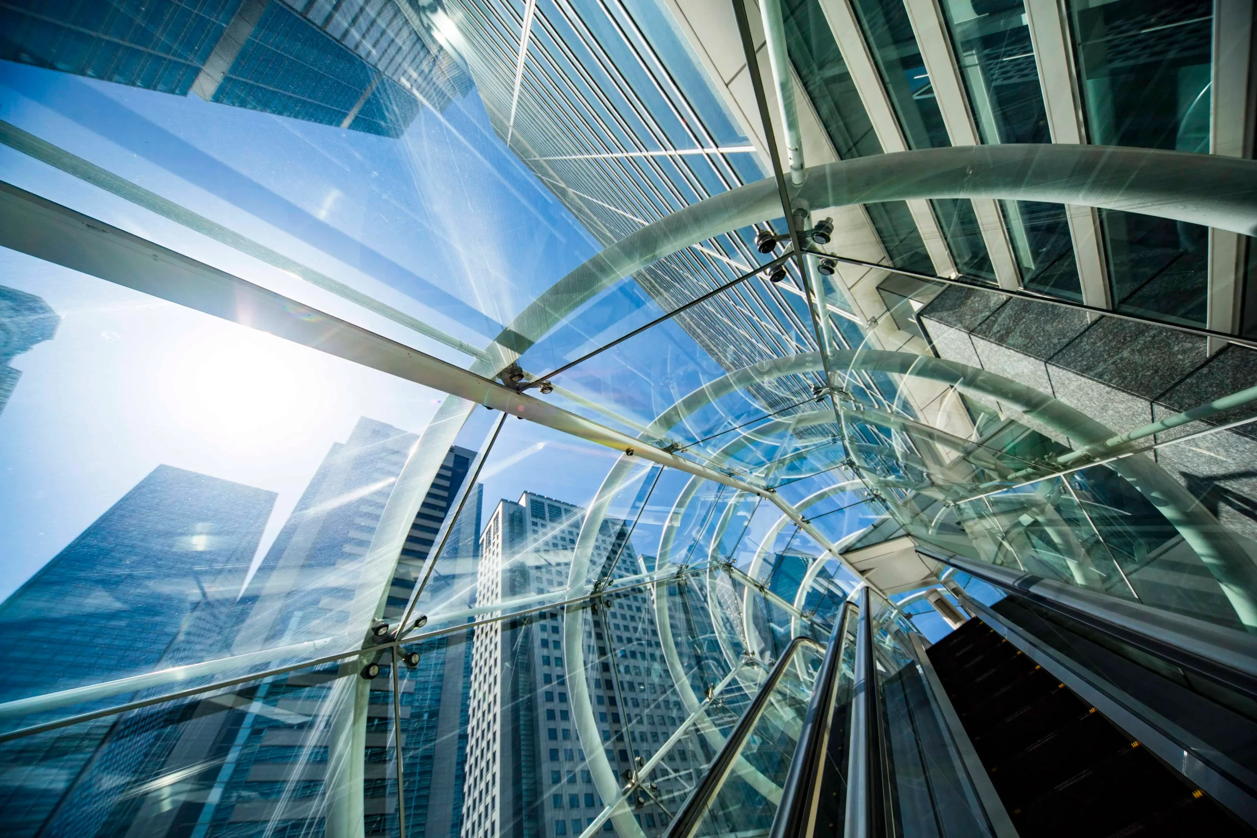 glass covered escalator ascending up