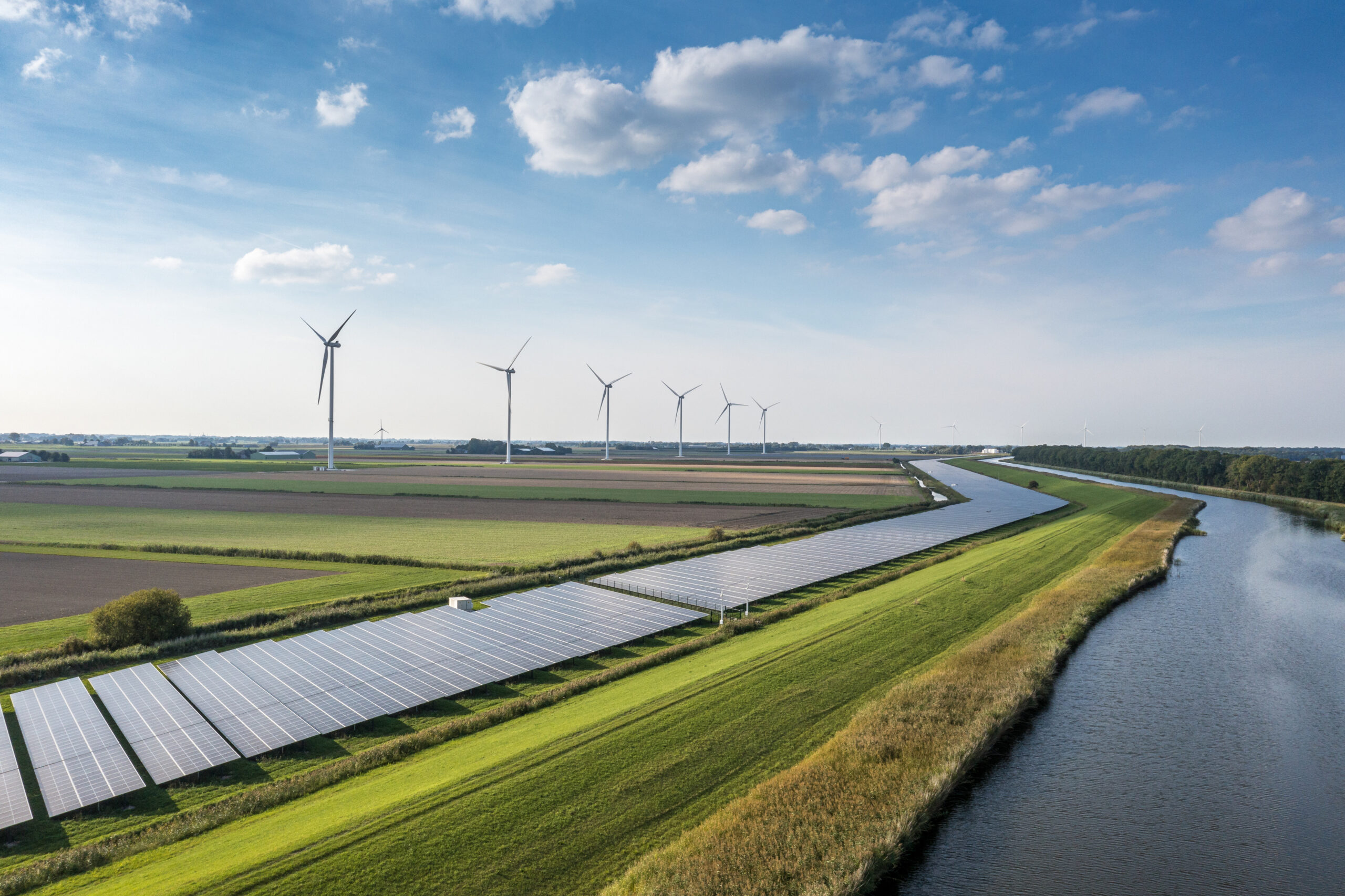 Solar panels and wind turbines generating renewable energy for green and sustainable future